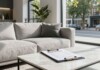 Modern apartment living room with clipboard on coffee table.