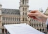 Keys and documents for a property inheritance in Brussels.
